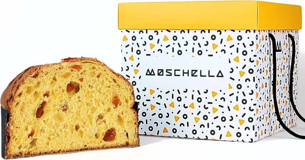 Un panettone gourmet con una fetta tagliata, accanto a una scatola decorativa con il logo Moschella.